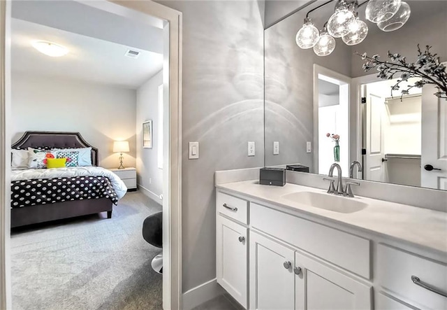8013 Payne St, Shawnee, KS 66220 - ensuite bathroom with vanity and baseboards