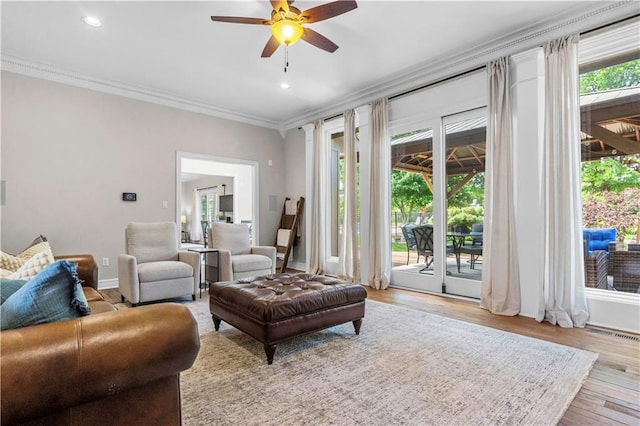 15618 Meadowbrook Ct, Raymore, MO 64083 - living area featuring ornamental molding, ceiling fan, wood finished floors, baseboards, and recessed lighting