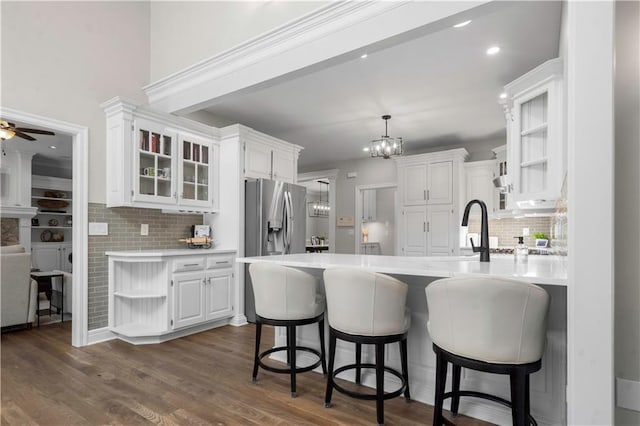 15618 Meadowbrook Ct, Raymore, MO 64083 - kitchen with open shelves, white cabinetry, tasteful backsplash, light countertops, and recessed lighting
