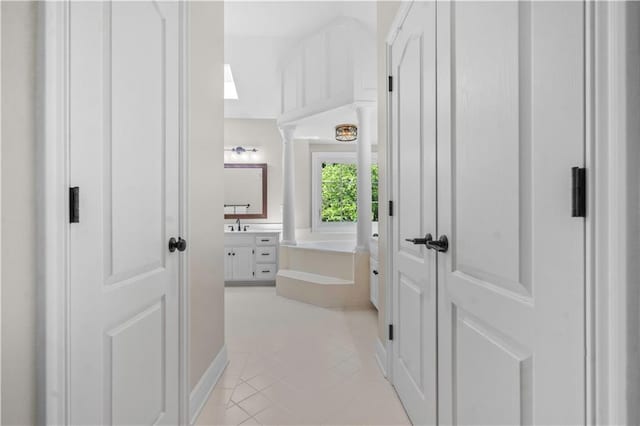 15618 Meadowbrook Ct, Raymore, MO 64083 - full bath featuring vanity, a garden tub, and tile patterned floors