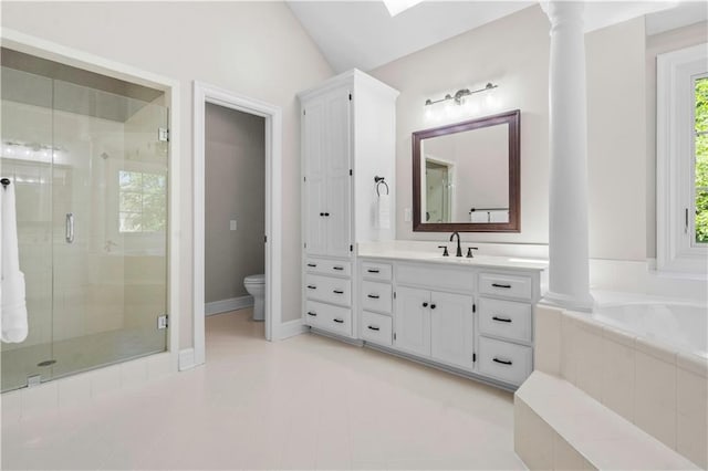 15618 Meadowbrook Ct, Raymore, MO 64083 - full bathroom featuring vanity, a stall shower, a garden tub, toilet, and ornate columns