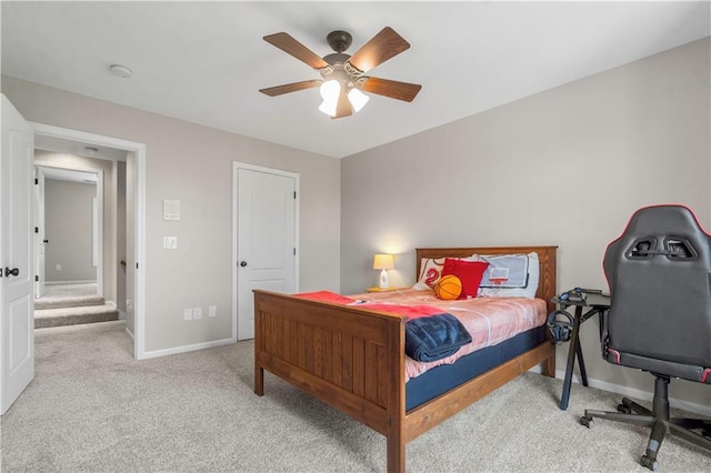 15618 Meadowbrook Ct, Raymore, MO 64083 - bedroom with light colored carpet, baseboards, and ceiling fan