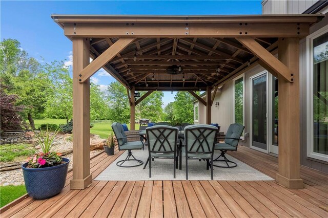 15618 Meadowbrook Ct, Raymore, MO 64083 - wooden deck with a gazebo and outdoor dining area