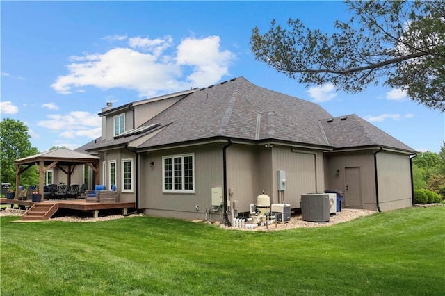 15618 Meadowbrook Ct, Raymore, MO 64083 - rear view of property featuring a gazebo, a wooden deck, a yard, and central air condition unit