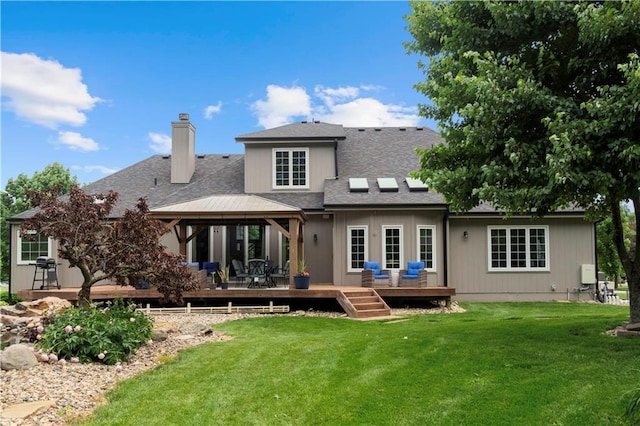 15618 Meadowbrook Ct, Raymore, MO 64083 - rear view of property with a chimney, a wooden deck, and a lawn
