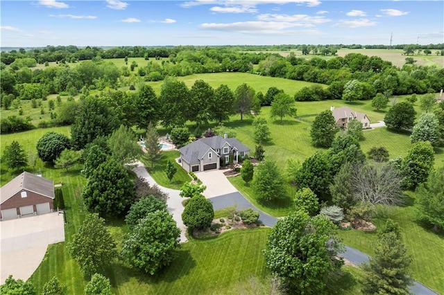 15618 Meadowbrook Ct, Raymore, MO 64083 - drone / aerial view of a tree filled landscape