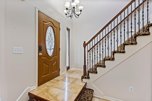 14401 Craig Ave, Grandview, MO 64030 - entrance foyer with a chandelier, baseboards, and stairway