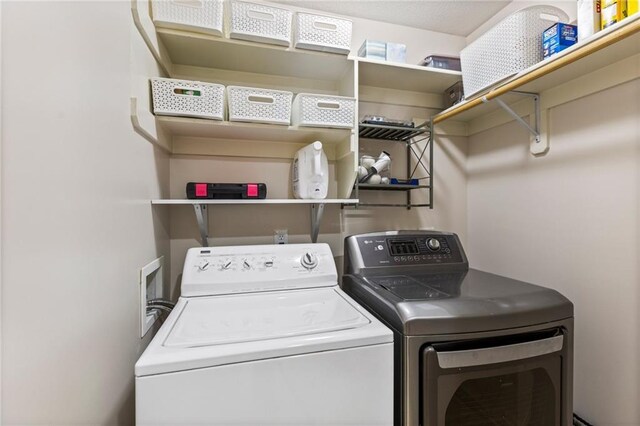 14401 Craig Ave, Grandview, MO 64030 - laundry room featuring separate washer and dryer