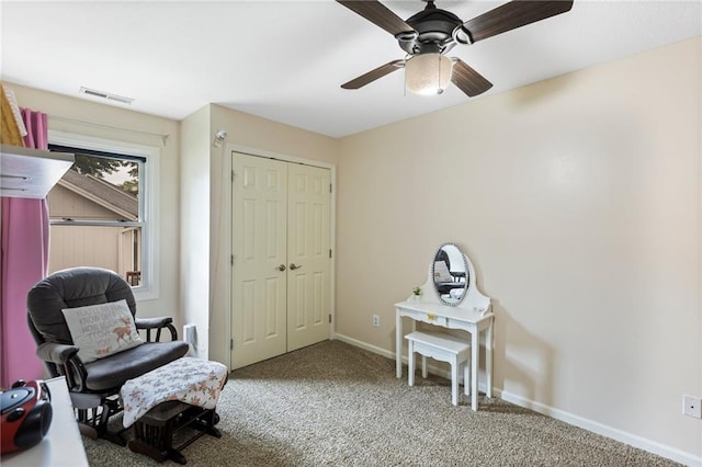 14401 Craig Ave, Grandview, MO 64030 - living area with carpet, baseboards, and ceiling fan