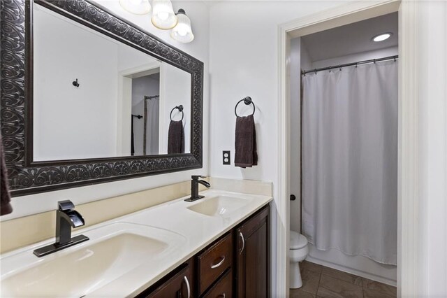 14401 Craig Ave, Grandview, MO 64030 - bathroom with double vanity and toilet