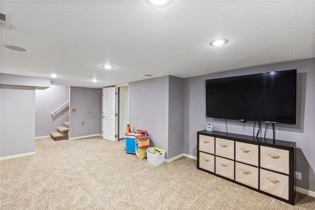 14401 Craig Ave, Grandview, MO 64030 - rec room with carpet flooring, baseboards, a textured ceiling, and recessed lighting