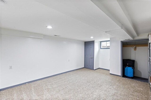 14401 Craig Ave, Grandview, MO 64030 - below grade area featuring light carpet, baseboards, and recessed lighting