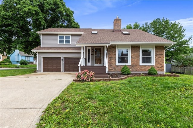 14401 Craig Ave, Grandview, MO 64030 - split level home with a chimney, a garage, concrete driveway, and brick siding