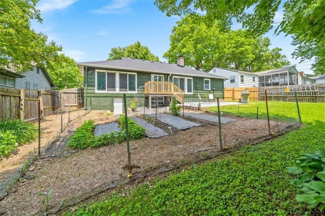 811 W 86th Ter, Kansas City, MO 64114 - rear view of house featuring a chimney, a fenced backyard, and a wooden deck