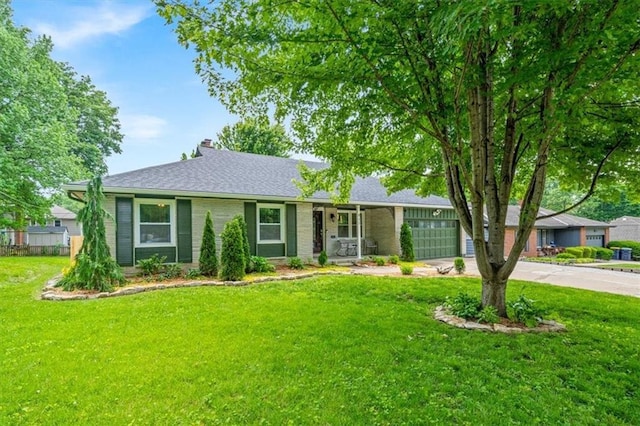 811 W 86th Ter, Kansas City, MO 64114 - single story home with an attached garage, a front yard, and concrete driveway