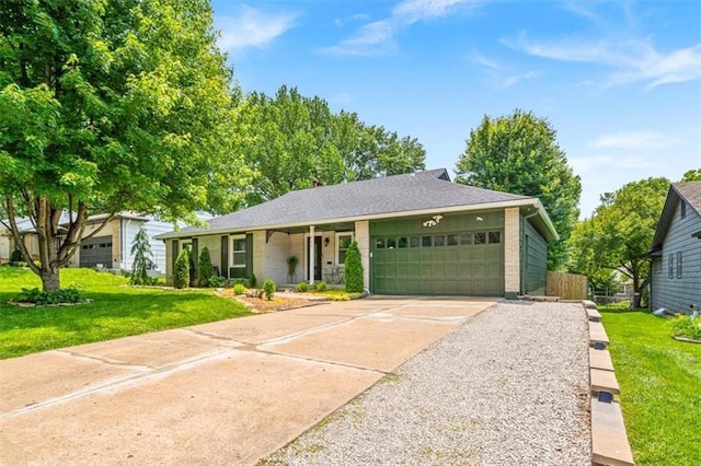 811 W 86th Ter, Kansas City, MO 64114 - ranch-style home featuring a garage, driveway, and brick siding