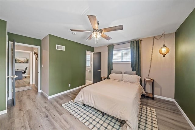 811 W 86th Ter, Kansas City, MO 64114 - bedroom featuring wood finished floors and ceiling fan
