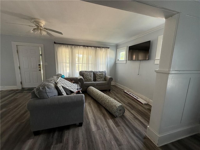 418 N 8th St, Independence, KS 67301 - living area featuring baseboards, ceiling fan, dark wood-style flooring, and crown molding