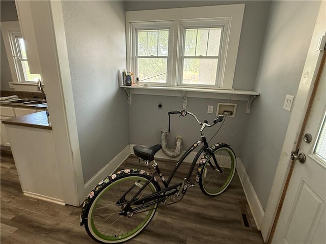 418 N 8th St, Independence, KS 67301 - interior space with a sink, baseboards, and wood finished floors