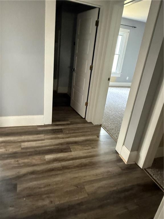418 N 8th St, Independence, KS 67301 - hall with baseboards and dark wood-style floors