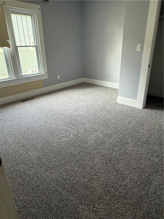 418 N 8th St, Independence, KS 67301 - empty room with carpet flooring and baseboards
