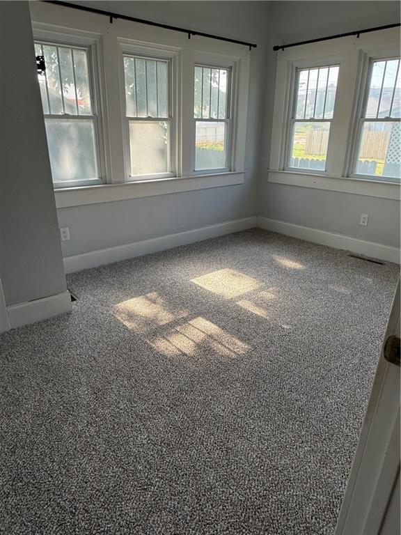 418 N 8th St, Independence, KS 67301 - spare room with baseboards and carpet floors