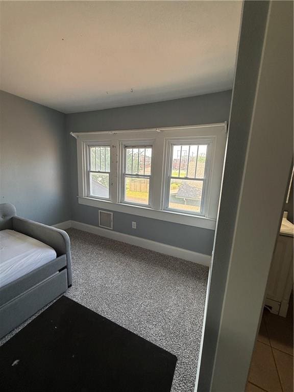 418 N 8th St, Independence, KS 67301 - bedroom with baseboards and carpet floors