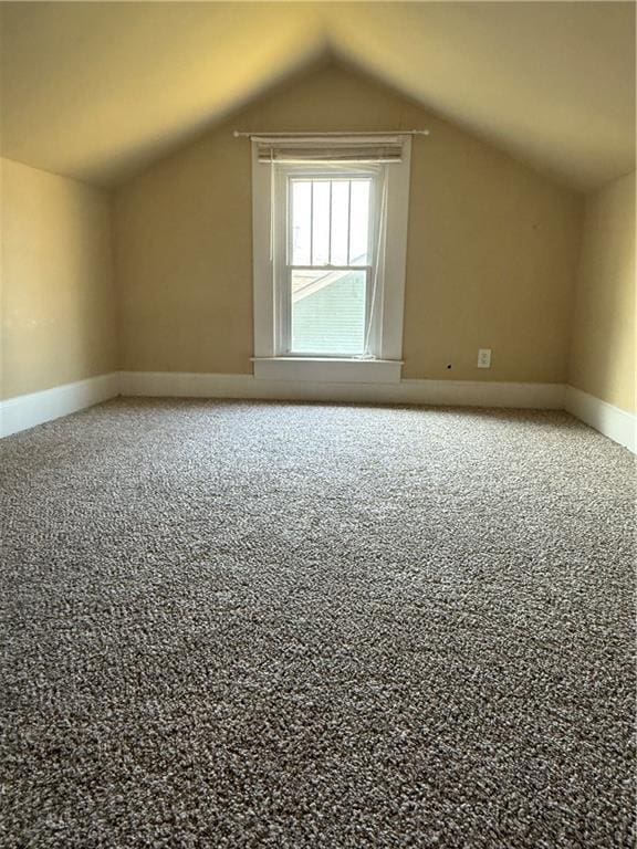 418 N 8th St, Independence, KS 67301 - additional living space featuring lofted ceiling, carpet, and baseboards