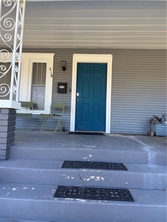 418 N 8th St, Independence, KS 67301 - property entrance with covered porch