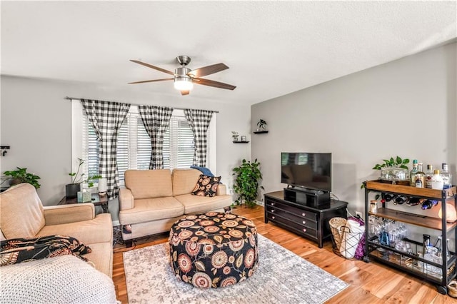 7041 Garnett St, Shawnee, KS 66203 - living area featuring a ceiling fan and wood finished floors