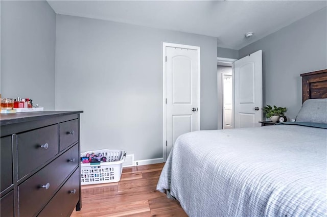 7041 Garnett St, Shawnee, KS 66203 - bedroom with wood finished floors and baseboards