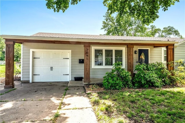 7041 Garnett St, Shawnee, KS 66203 - ranch-style house with an attached garage and driveway
