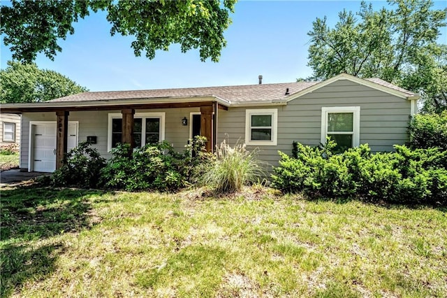 7041 Garnett St, Shawnee, KS 66203 - ranch-style home featuring an attached garage and a front lawn