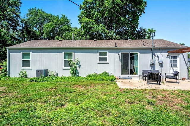 7041 Garnett St, Shawnee, KS 66203 - back of property featuring a patio area, a yard, and cooling unit