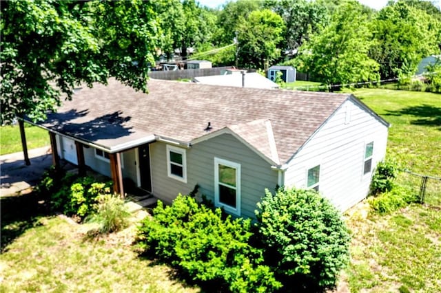 7041 Garnett St, Shawnee, KS 66203 - rear view of house with roof with shingles