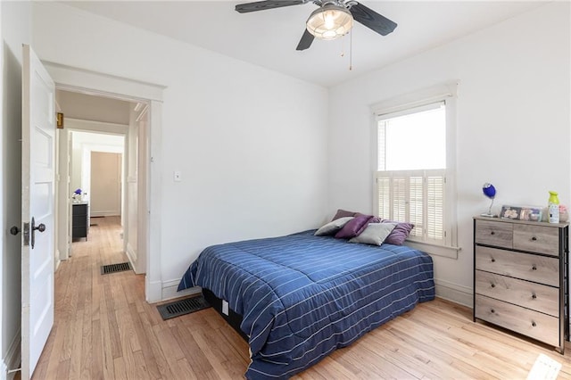 4231 Wyoming St, Kansas City, MO 64111 - bedroom featuring light wood-type flooring, baseboards, and a ceiling fan