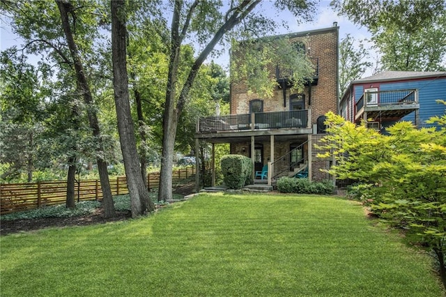 1633 Summit St, Kansas City, MO 64108 - back of house with stairs, a wooden deck, and brick siding