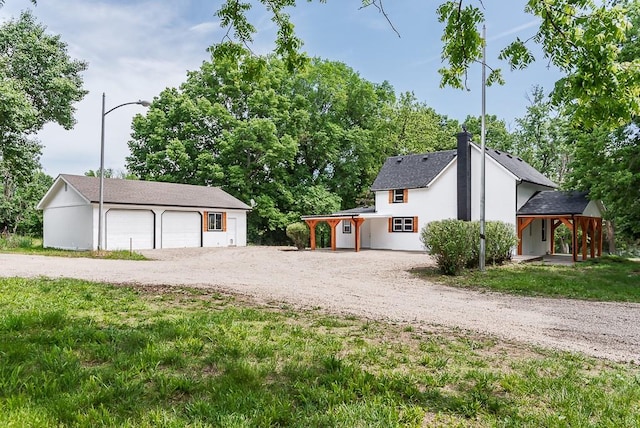 23852 Haigwood Rd, Tonganoxie, KS 66086 - view of front of property with a garage and an outbuilding