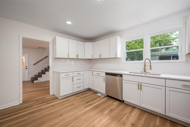 23852 Haigwood Rd, Tonganoxie, KS 66086 - kitchen with dishwasher, a sink, decorative backsplash, light countertops, and recessed lighting