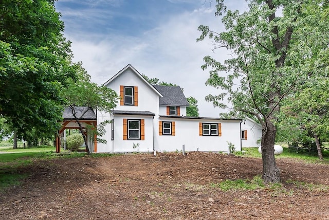 23852 Haigwood Rd, Tonganoxie, KS 66086 - view of front facade featuring stucco siding and roof with shingles