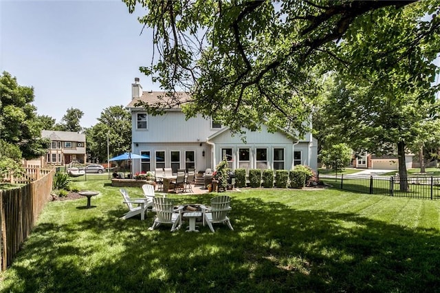 14169 W 115th Ter, Olathe, KS 66062 - rear view of house featuring a fenced backyard, a chimney, and a patio