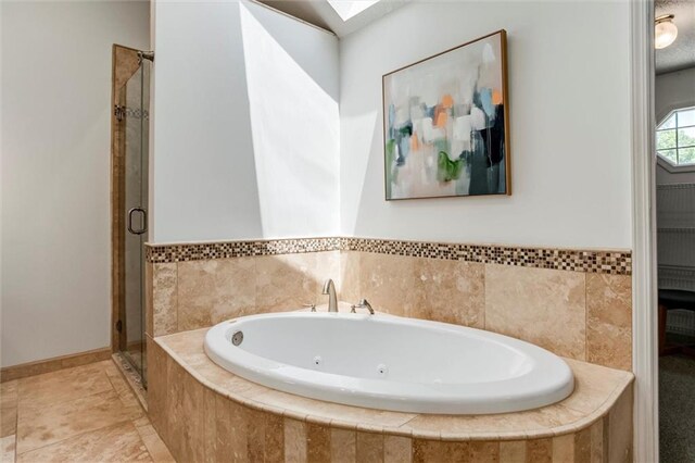 14169 W 115th Ter, Olathe, KS 66062 - full bath with a whirlpool tub, a stall shower, and a skylight