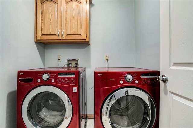14169 W 115th Ter, Olathe, KS 66062 - laundry room featuring washing machine and dryer and cabinet space