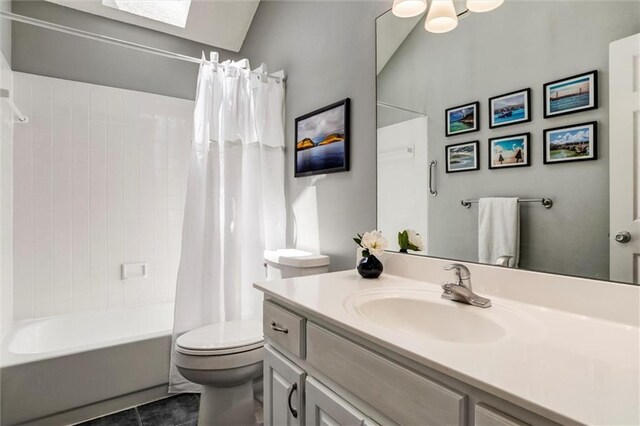 14169 W 115th Ter, Olathe, KS 66062 - full bath featuring vanity, shower / bath combo with shower curtain, tile patterned flooring, and a skylight