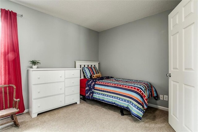 14169 W 115th Ter, Olathe, KS 66062 - bedroom featuring carpet flooring and a textured ceiling