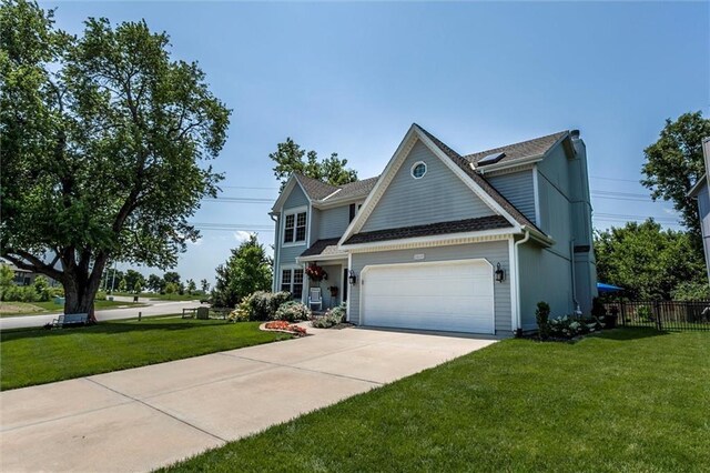 14169 W 115th Ter, Olathe, KS 66062 - traditional-style house with a garage, driveway, and a shingled roof