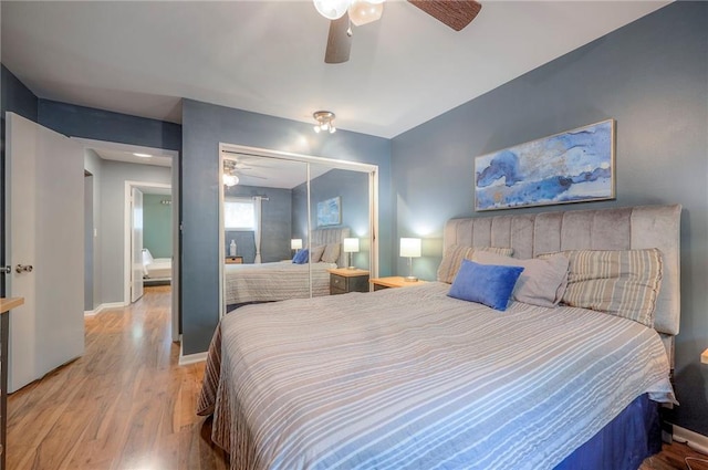 6520 W 51st St, Mission, KS 66202 - bedroom featuring wood finished floors, a closet, a ceiling fan, and baseboards