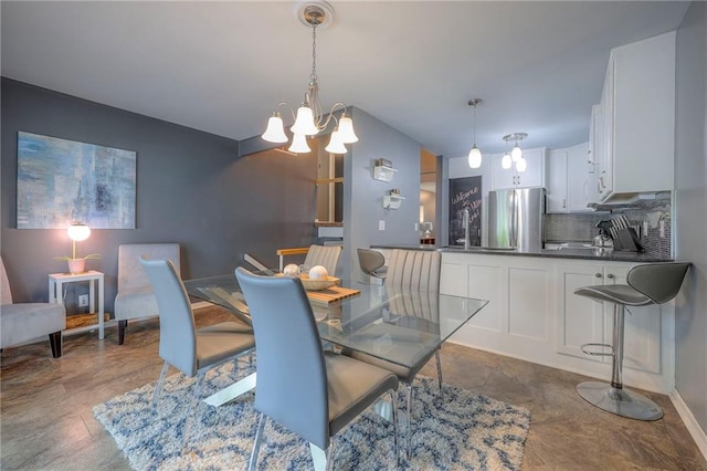 6520 W 51st St, Mission, KS 66202 - dining space featuring a chandelier and baseboards