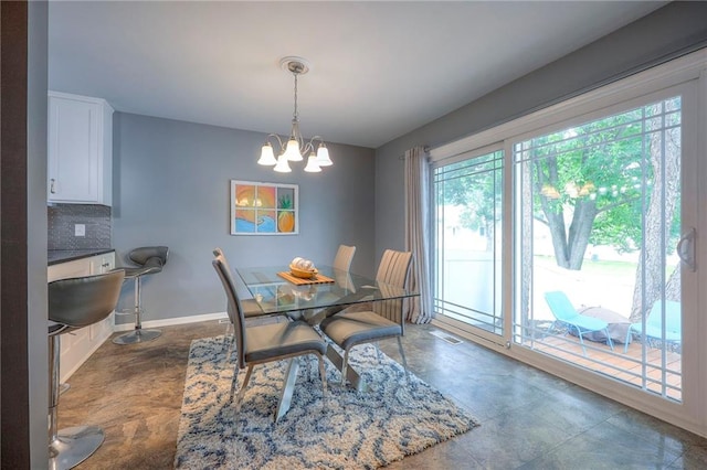 6520 W 51st St, Mission, KS 66202 - dining room featuring a chandelier and baseboards
