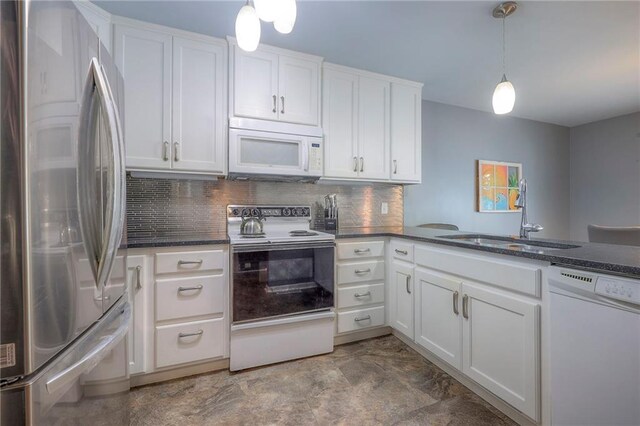 6520 W 51st St, Mission, KS 66202 - kitchen featuring white appliances, a sink, white cabinetry, backsplash, and dark stone counters